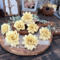 Garden inspired faux wood flower blossoms hand painted in a custom dusty yellow. 